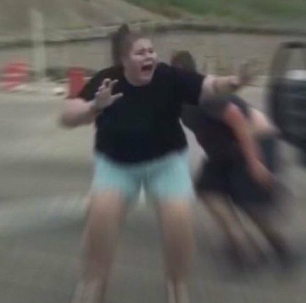 A picture of a girl screaming in fear with zoomed in speed lines around her. 