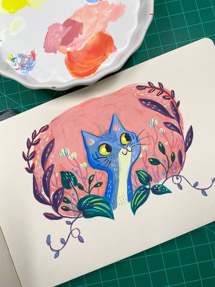 Gouache painting of a blue cat on a pink background with some leaves and flowers on the side