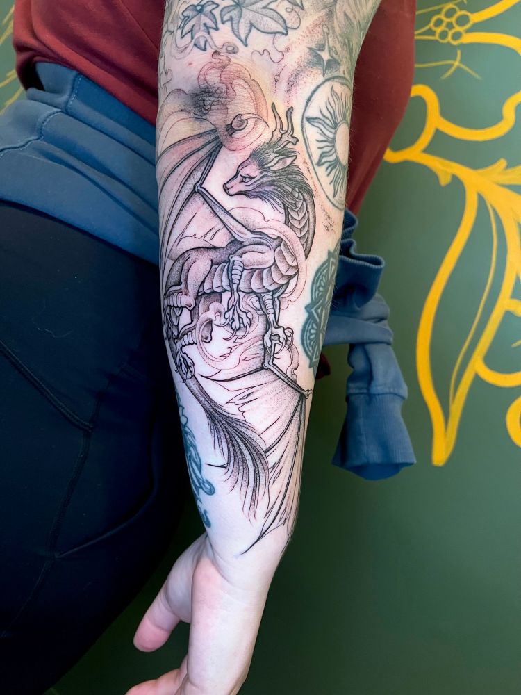 Black illustrated dragon tattoo 