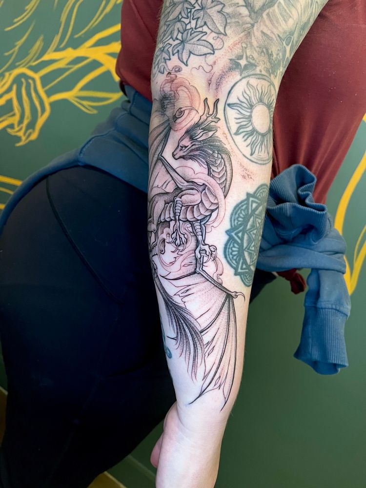 Black illustrated dragon tattoo 