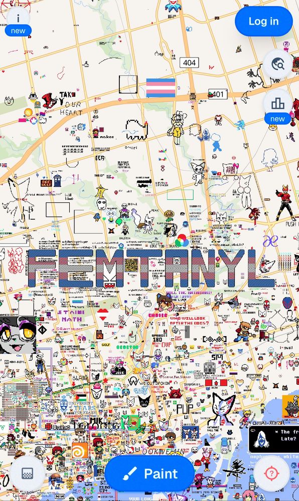 wplace, a map users can paint pixels over. there's a giant trans flag coloured "FEMTANYL" over Toronto