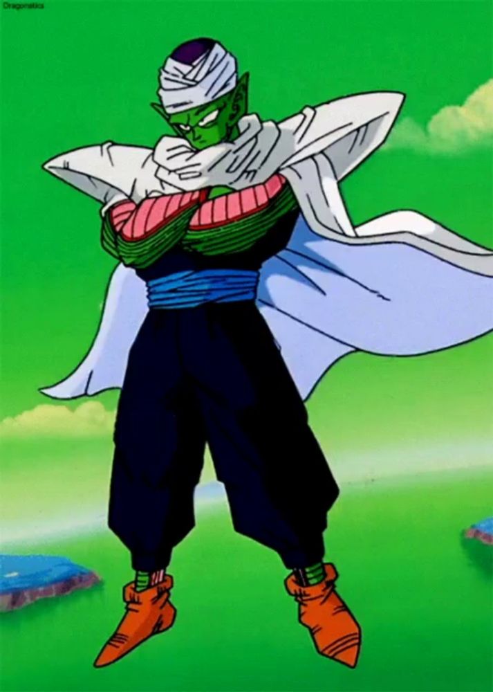 piccolo from dragon ball z is standing in a field with his arms crossed