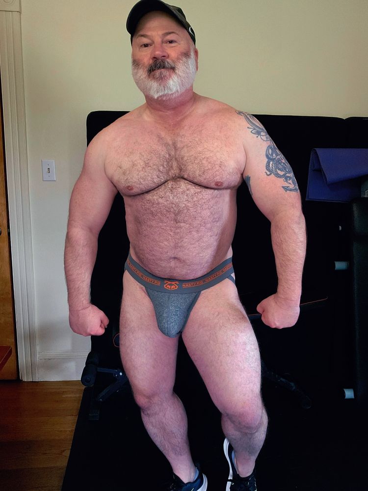 Old dude showing level of fitness in underwear 