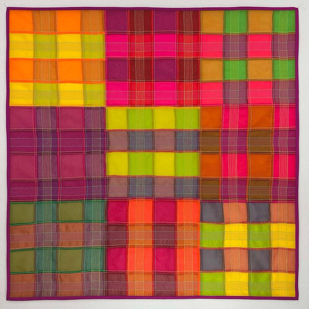 36" x 36"

Description: I enjoy using quilting stitches to create an illusion of transparency, but what happens to that stitching when the entire quilt is translucent? In this quilt, I used three layers of silk organza to develop a design reliant on transparency. The first two layers are simple stripes that alternate directions to create a plaid effect. The third layer of white organza creates a pastel version of the design when the quilt is reversed.