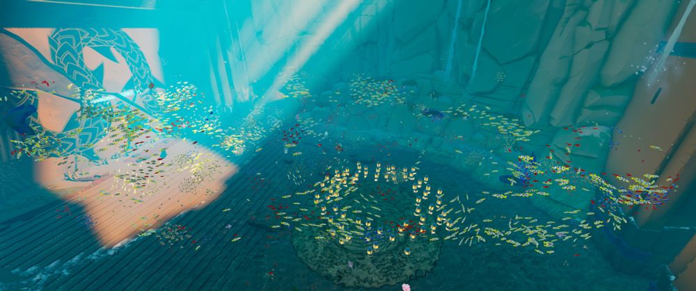 Screenshot in the cavern, looking down at the floor. A beam of sunlight is lighting the left side. Hundreds of fish in schools are swimming in small circles. 