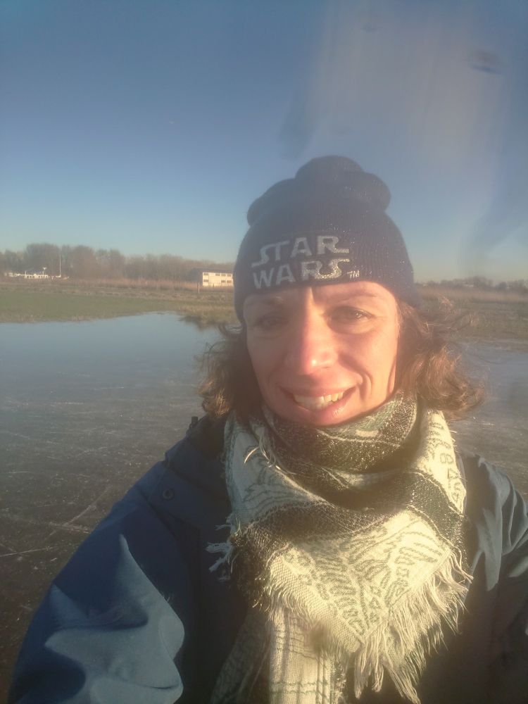 A selfie of a women wearing a Star Wars hat