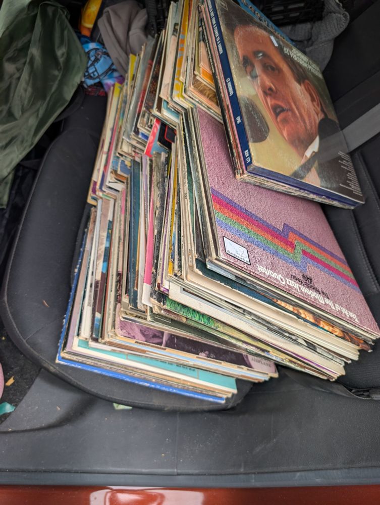 Two large stacks of records on the back seat of my shitty car. 