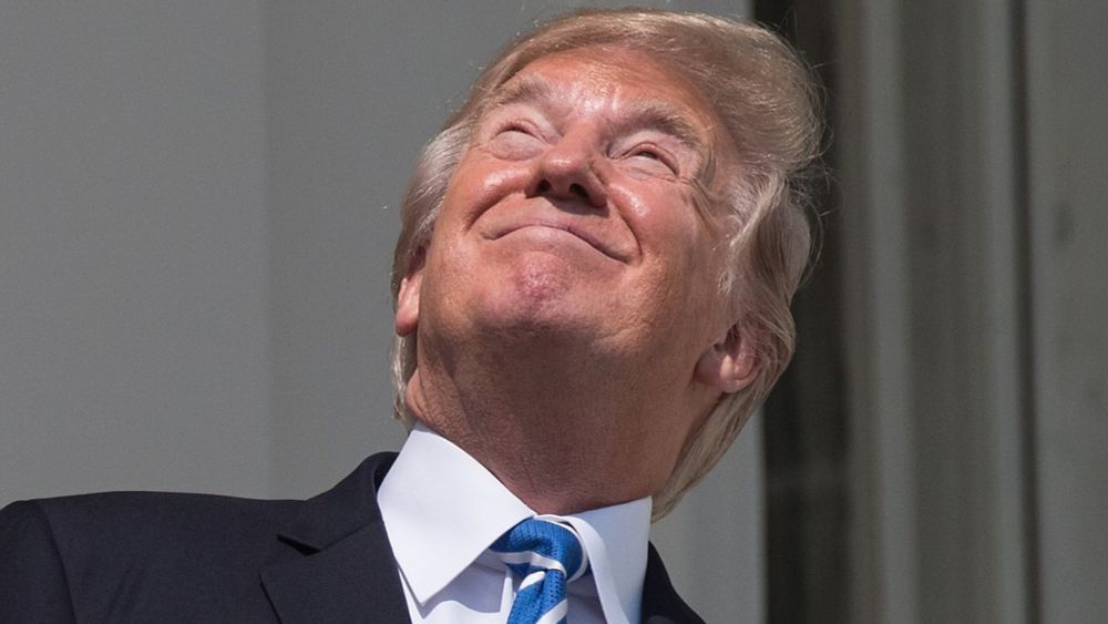 Trump happily staring directly at the sun during outside of the White House