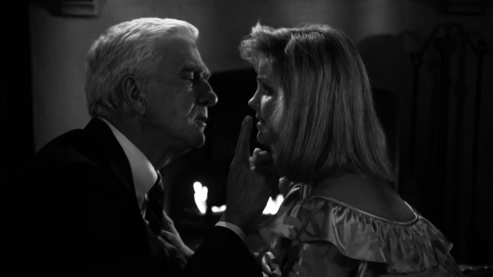 Dreben and Jane sharing a fireside dinner, in black and white