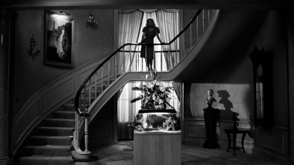 Jane Spencer femme fatale stair intro sequence, in black and white