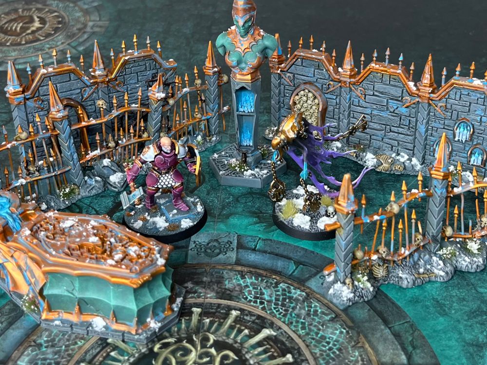 Same as previous picture with a stormcast liberator and nighthaunt character battling