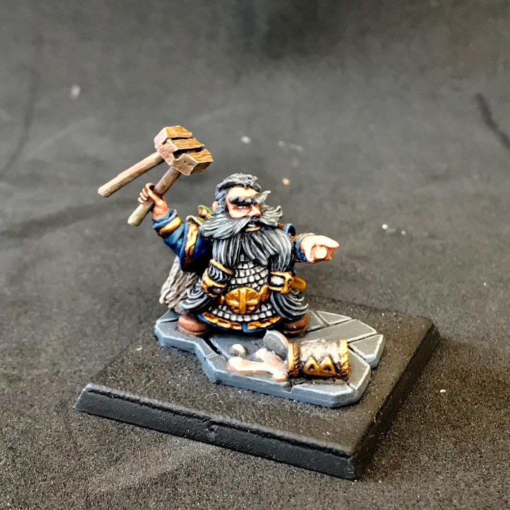Metal bugman sculpt holding a bar stool over a spilled pint painted 