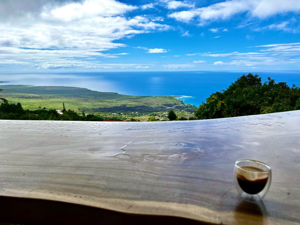 Overlooking the ocean and blue sky high up in the mountains 