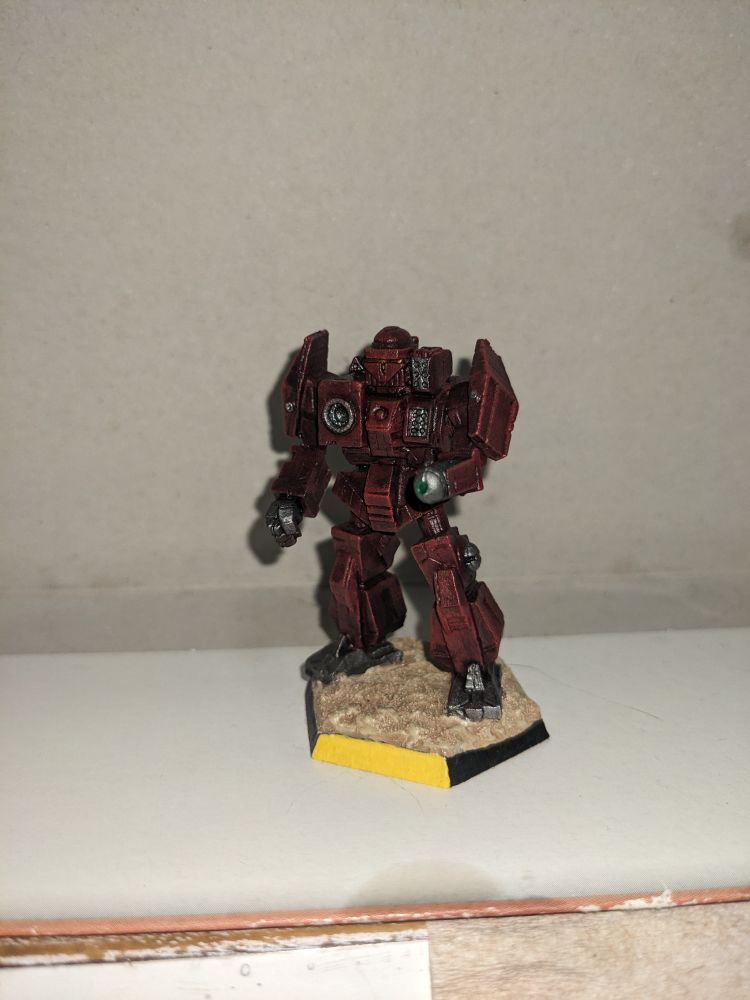 A single metal Charger miniature facing front.