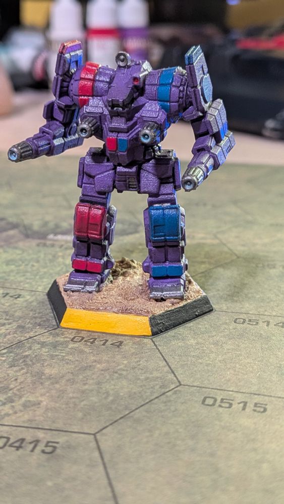 A front view of an IWM Awesome mech painted in Marik Militia Colors (Purple with red and blue accents).