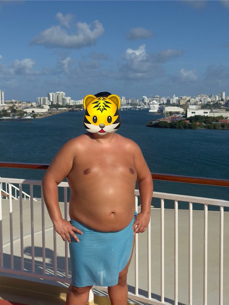 In port at San Juan, Puerto Rico. While we are in port clothing is required. We can wear as little as we want though, as long as our private bits are covered. 