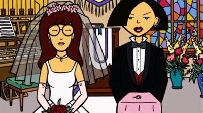Daria and Jane from the early 2000 cartoon Daria. Here, they are dressed up as bride and groom. They were never a couple but there was always something about them that was queer-coded & the creative team behind the show acknowledged that. 
