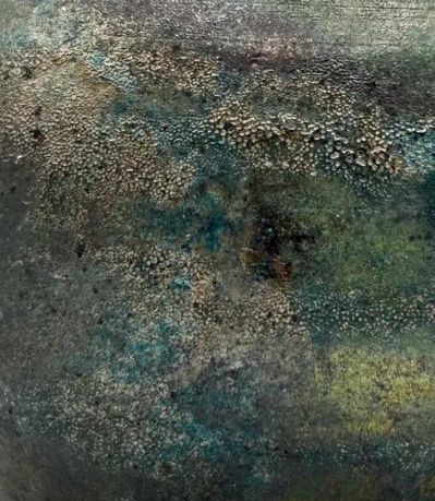 A close up of the texture/finish of the raku pottery vase, Forest Nebula. 