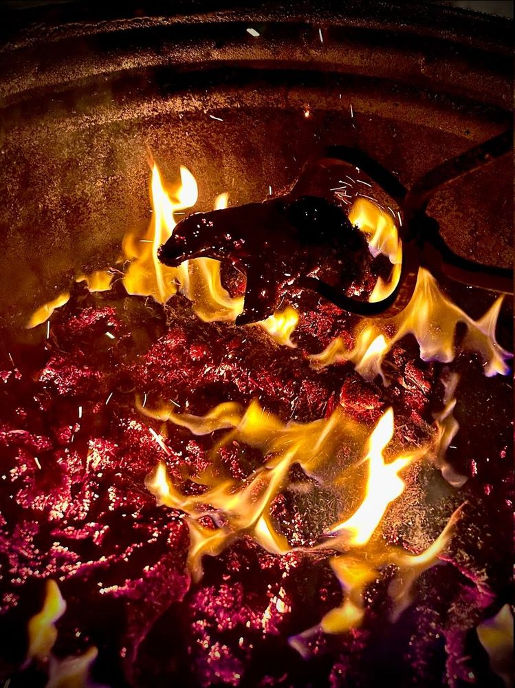 A view of the bear during the raku firing process.