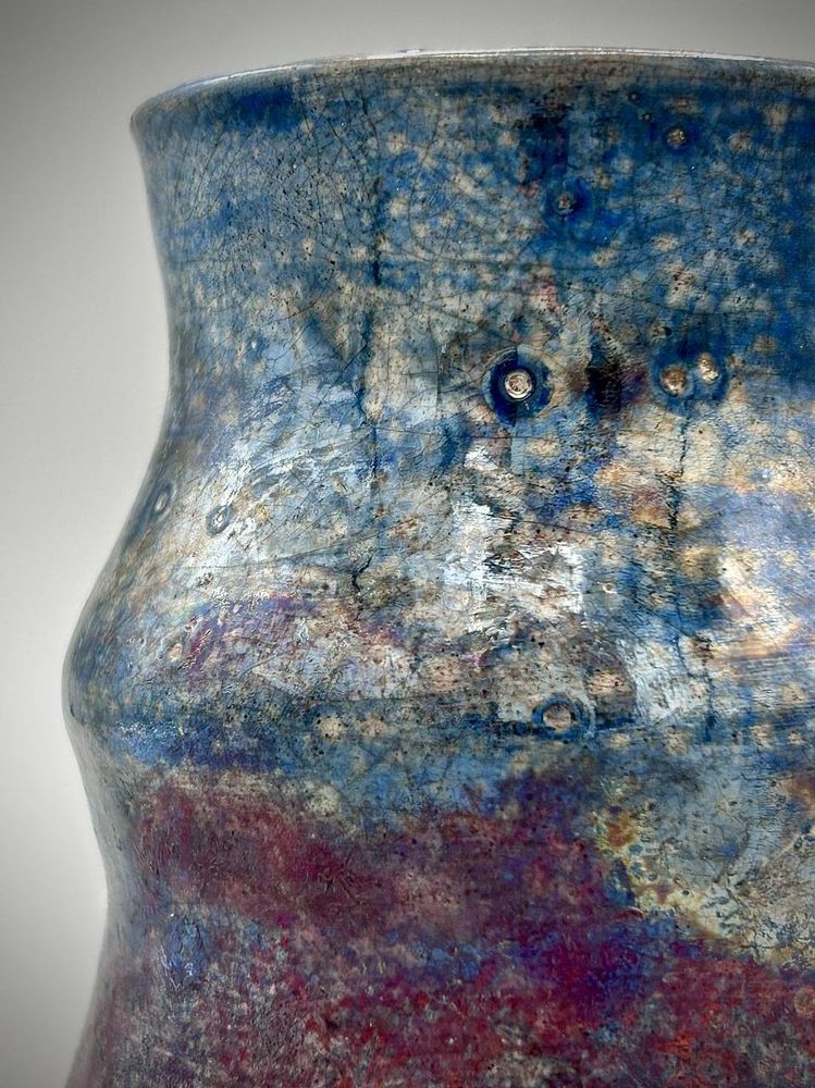 A close up of the top half of the raku vase. 