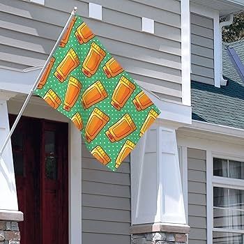 Fasadflagga i grönt och orange med motiv av hudlotiontuber