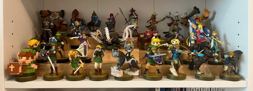 A tiered shelf display of all the Zelda Amiibo