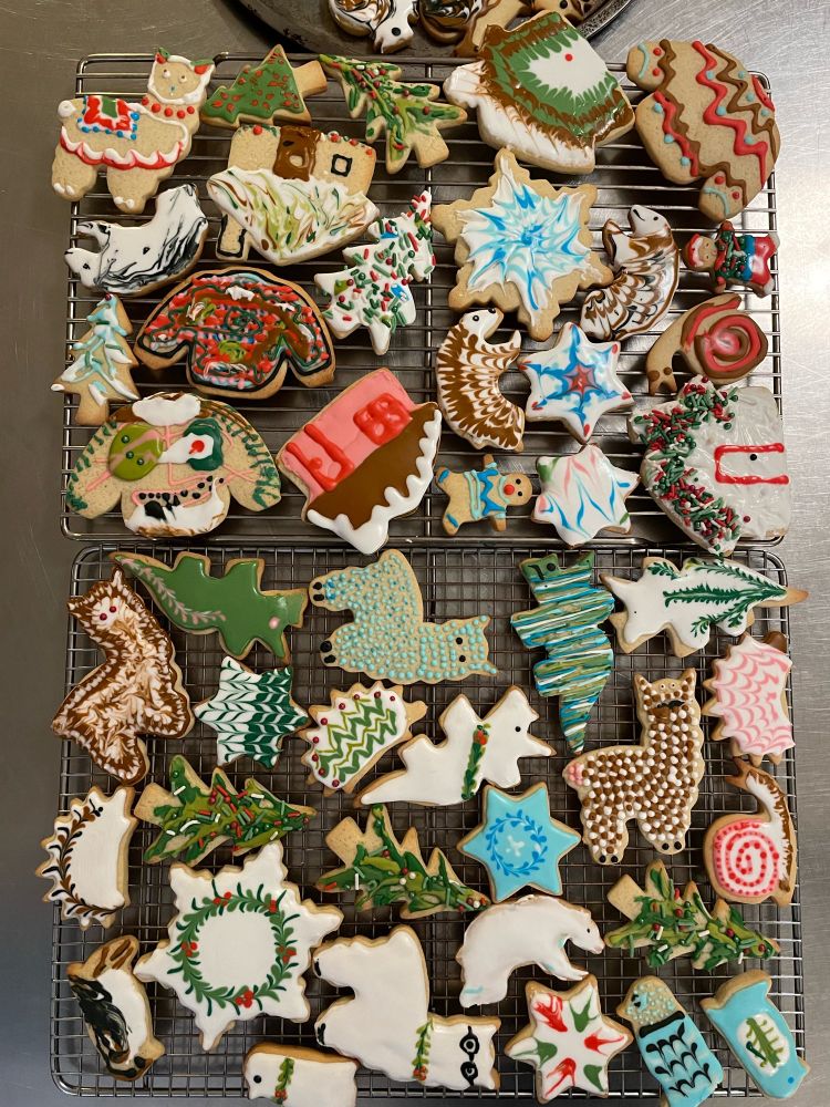 A large assortment of decorated sugar cookies