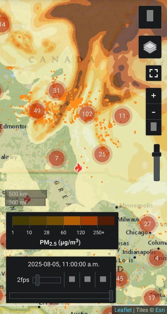 Screenshot of a map from FireSmoke.ca showing hundreds of wildfires burning in northern Manitoba and Saskatchewan and the smoke billowing all across the continent