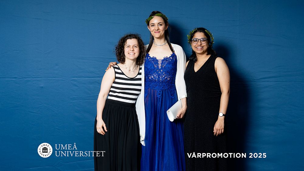 Varvara Dikaya, Nabila El Arbi and Sanchali Nanda wearing full dresses are standing next to each other smiling into the camera. Photo credit: Samuel Pettersson, Umeå University