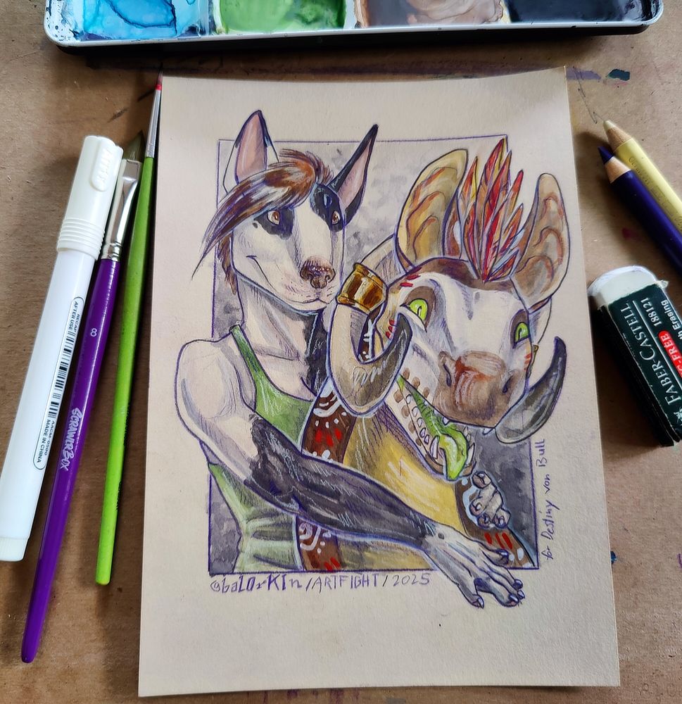 Photograph of a watercolour painting on beige mixed media paper. It's surrounded by art supplies used to create the painting. 
It shows an anthropomorphic English Bullterrier Girl with brown hair and a green Tanktop playfully holding back a very excited creature. The creator has a dinosaur-like head work skull face markings, huge bat-like ears and pointy horns. It has green eyes and tongue.