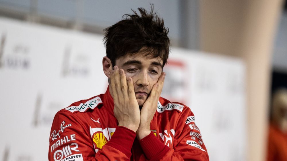 Formula One driver Charles Leclerc looking the most harrowed a person can possibly look. His hands dragging down his face like a cross between Edvard Munch's 'The Scream' and a sad puppy.