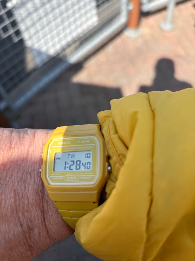 Yellow Casio watch with a yellow jacket 