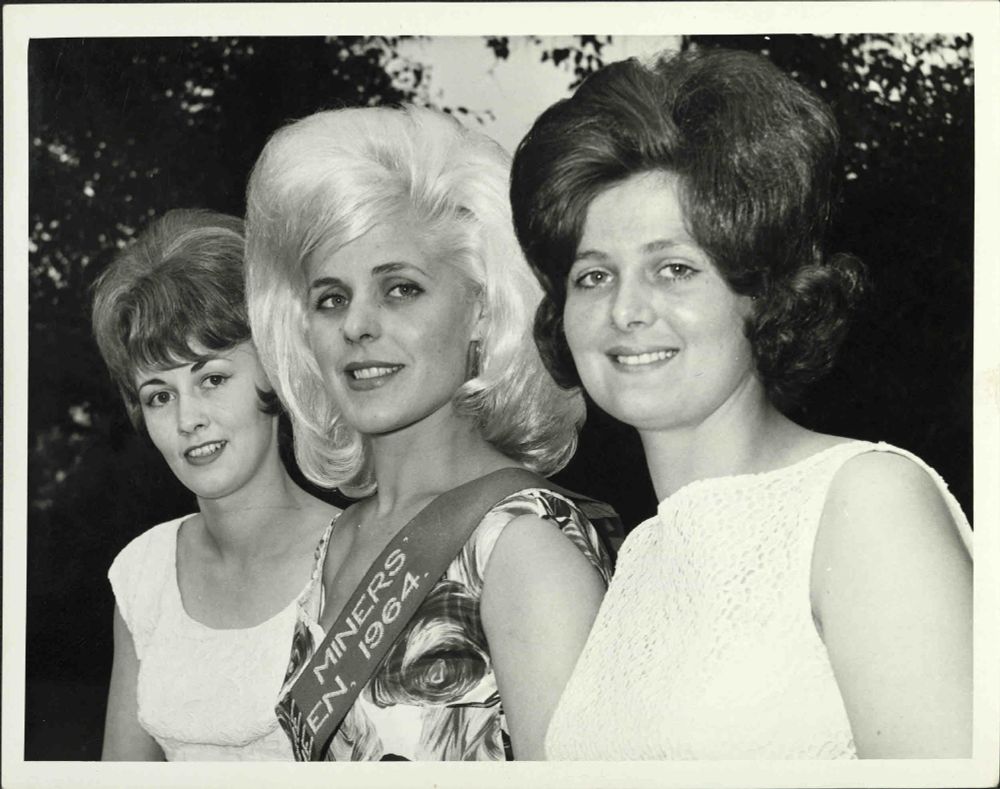 Photograph of three women at 1964 Yorkshire Miners' Annual Demonstration, held in Castleford. They were contestants for the Yorkshire Miners' Coal Queen competition.