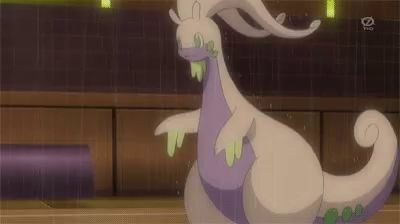 a white and purple pokemon is standing on a wooden floor in a room .