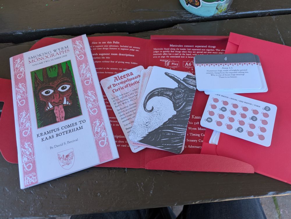 Overview of the book "Krampus Comes to Kaas Boterham" , as well as two sided foe cards (stats on one side, art on the other), a time tracker card, and sensory cue cards.