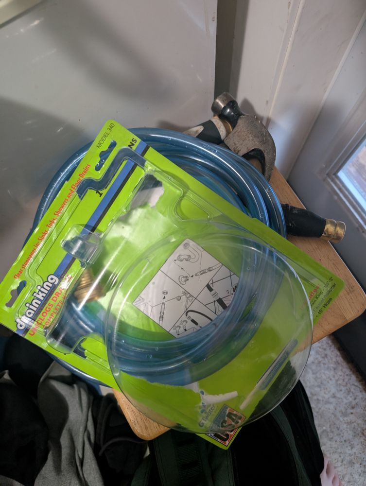 Drain King - a hose with an attachment that increases water pressure to blast cold water at the blockage.  