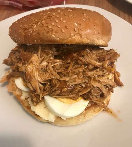 A well-lit photo of Slow Cooker Buffalo Chicken Sandwiches