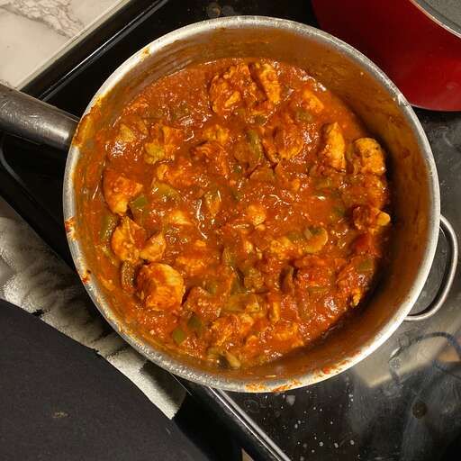 A well-lit photo of Scarlett's Chicken Cacciatore