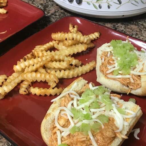 A well-lit photo of Slow Cooker Buffalo Chicken Sandwiches
