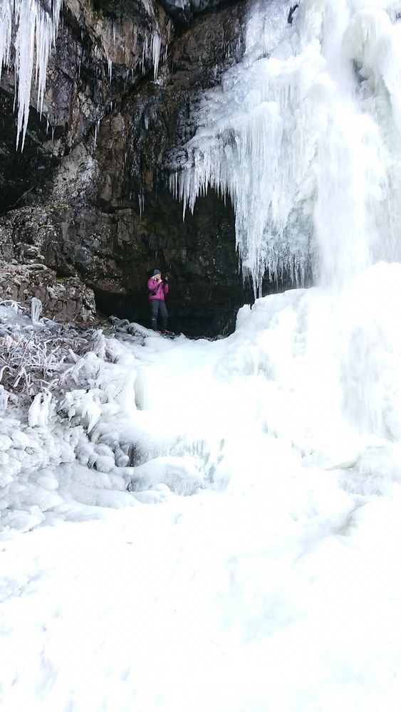 A frozen icy waterfall. I am standing on the section part way up where you could walk behind the frozen falls.