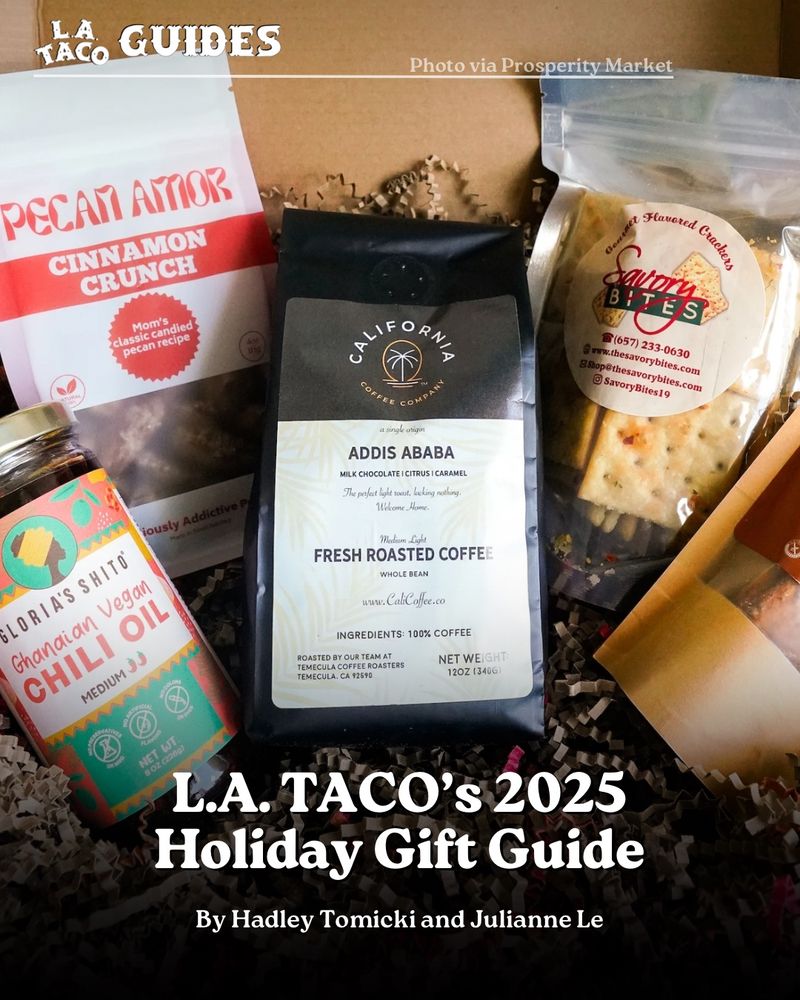 Image features a box gift set. Inside box there is a jar of chili oil, a bag candied pecans, a bag of coffee roast, a bag of crackers, and a bag of plantain chips.

The headline at the bottom of the image reads “L.A. TACO’s 2025 Holiday Gift Guide”
