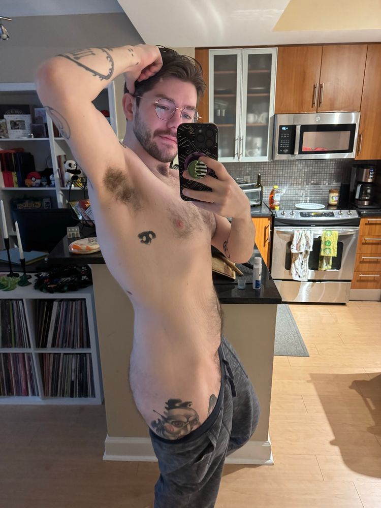 Me in blue joggers pulled down to show my ass and a tiny bit of bush. Arm is up and pit looks hairy and defined.