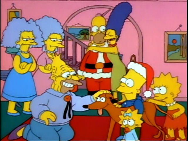 Scene from The Simpsons episode, "Simpsons Roasting on an Open Fire", in which Marge (Juile Kavner) hugs Homer (Dan Castellana) after getting the family Santa's Little Helper for Christmas.