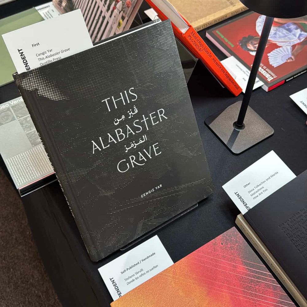 A selection of photobooks displayed on a table.