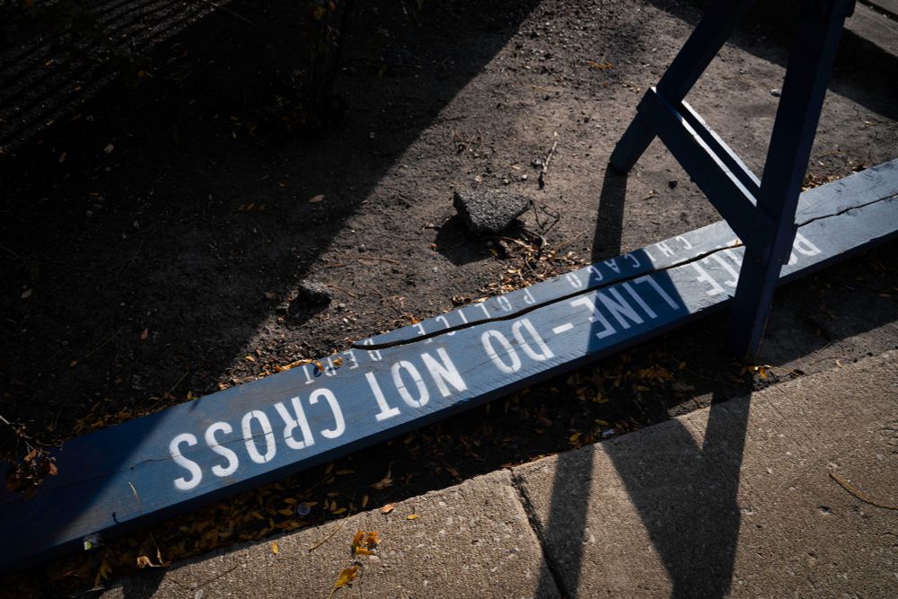 A photograph of a police barricade lying on the street. 