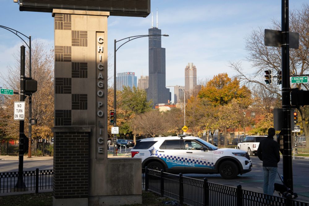 A photograph of a police suv driving through Chicago.