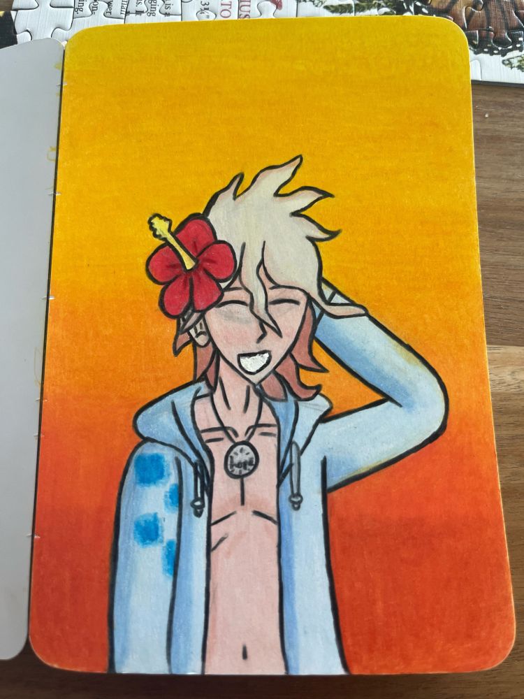 A picture of Nagito in his beach outfit behind an orange sunset