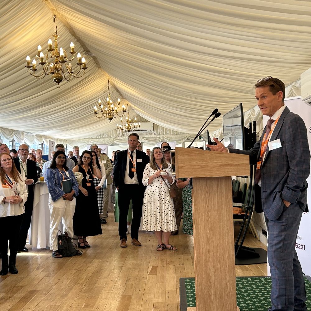 Mark Gillyon-Powell, Deputy Director - HCV Elimination and Health Inequalities for NHS England speaking to a crowd