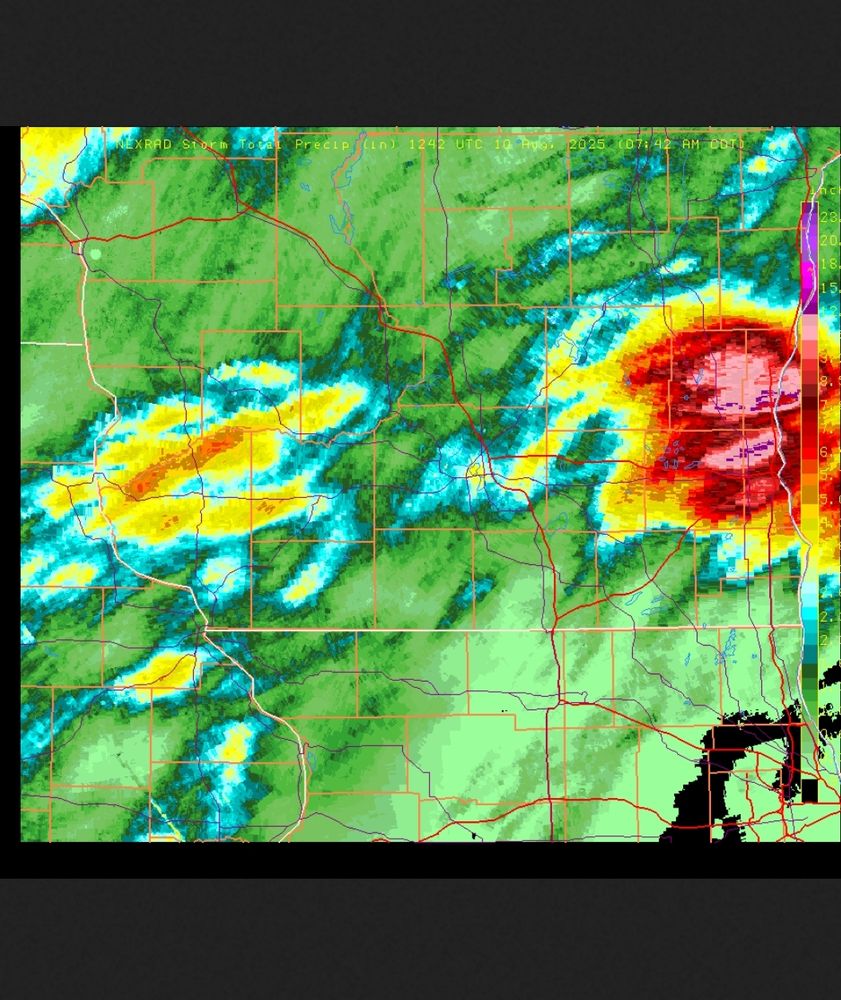 Graph showing rainfall accumulation with the color range from green to pink showing less to more, pink = 8+ inches of rain. The area is southern Wisconsin and the pink areas are over the Milwaukee metro area.