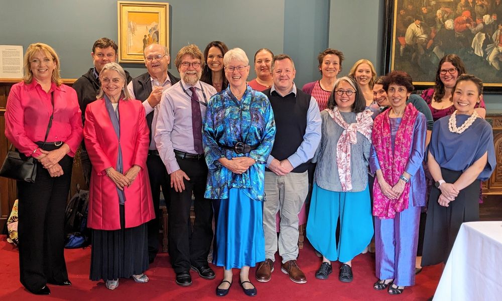 A group of Australian academics standing shoulder to shoulder, celebrating organising the successful Biomolecular Horizons Congress 2024, Melbourne, Victoria.